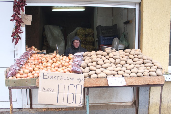 Man selling onions and potatoes in Sofia Bulgaria